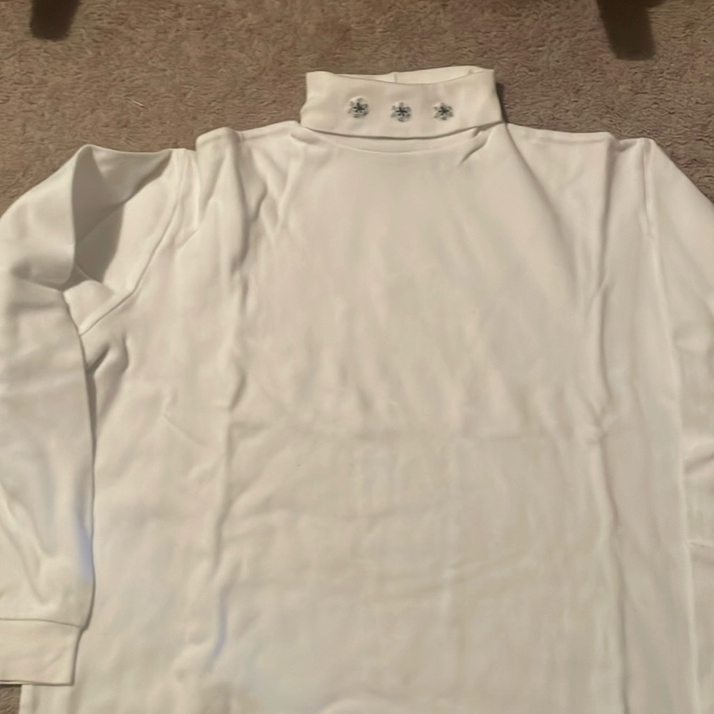 Women's white turtleneck with snowflakes on the neck
